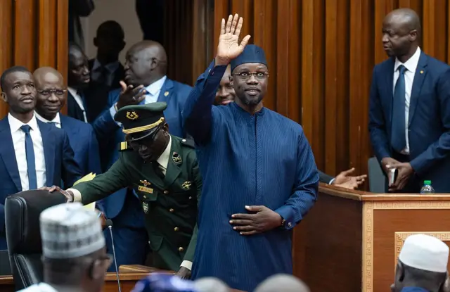 Ousmane Sonko greets members of Parliament upon arriving in Dakar on November 28, 2025