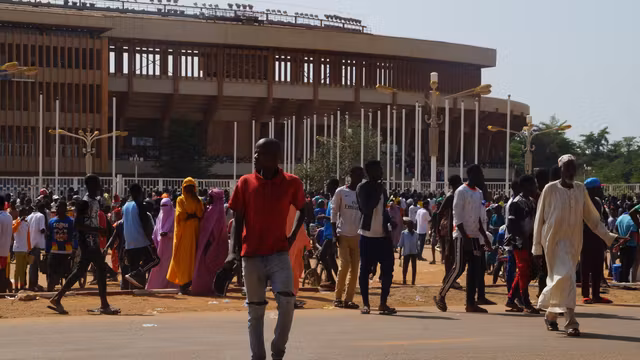 Nigeriens gather near the General-Seyni-Kountché stadium in Niamey for a civil militia recruitment session on August 19, 2023.