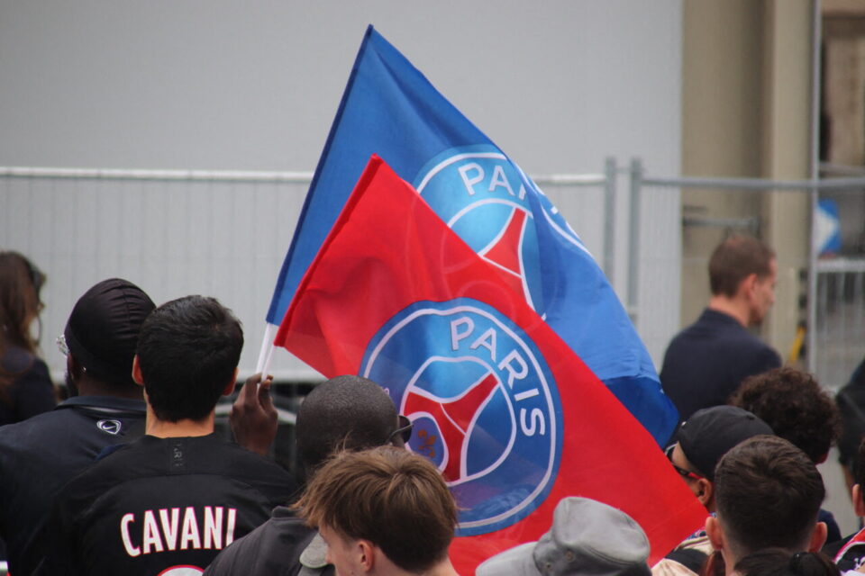 PSG fans celebrating during a previous parade on the Champs-Élysées