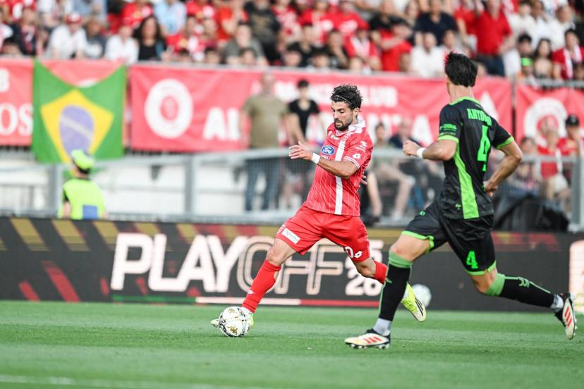 Patrick Cutrone and Monza players celebrate their Serie A promotion despite a tough playoff final