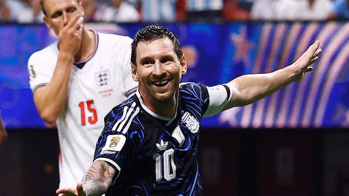 Lionel Messi smiling after scoring