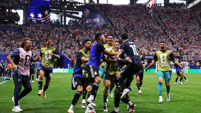 Football players celebrating a goal