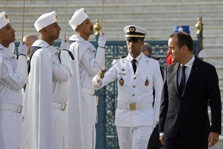 Sébastien Lecornu reviews a military honor guard in Rabat