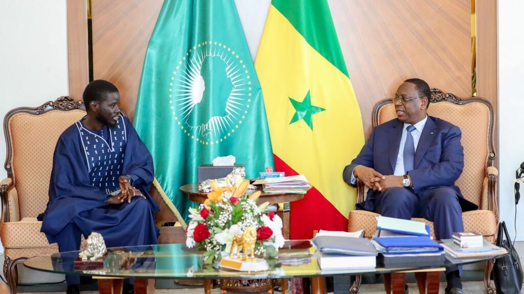 [Archival image] This photo provided by the Senegalese presidency shows outgoing Senegalese President Macky Sall (right) meeting with then newly elected President Bassirou Diomaye Faye (left) at the presidential palace in Dakar on March 28, 2024.