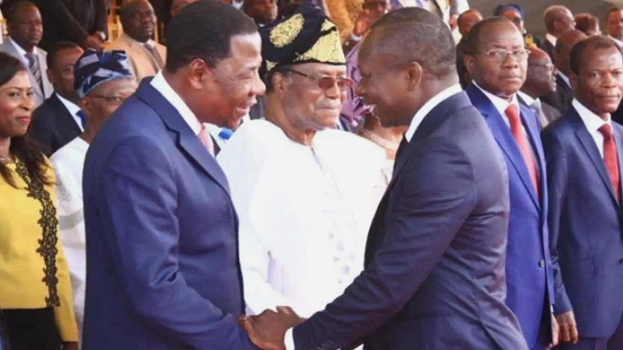 Former presidents Nicéphore Soglo (background in white), Boni Yayi (left), and Patrice Talon (right)